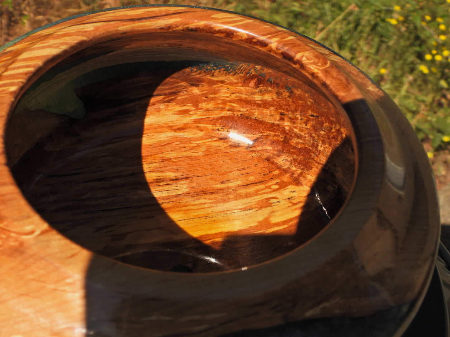 Inside of Wood and epoxy resin bowl in Seahawks football blue and green colors
