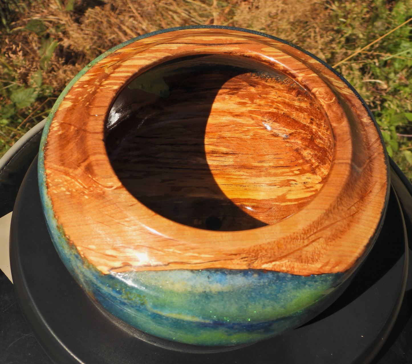Top view of Wood and epoxy resin bowl in Seahawks football blue and green colors