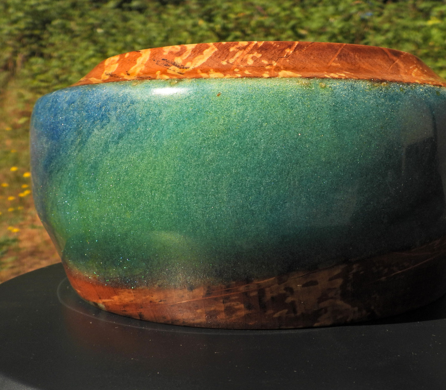 Green side of Wood and epoxy resin bowl in Seahawks football blue and green colors