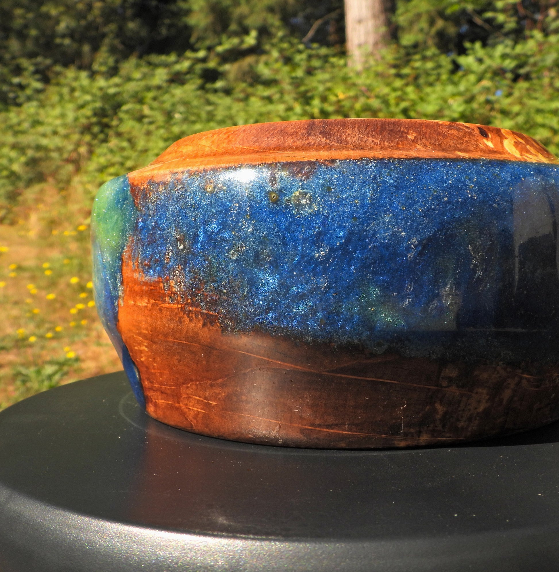 Back view of Wood and epoxy resin bowl in Seahawks football blue and green colors 